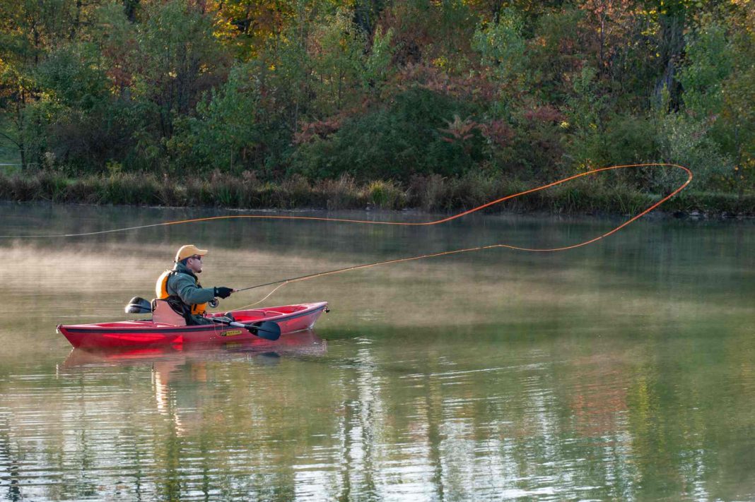 Fly fishing from a canoe